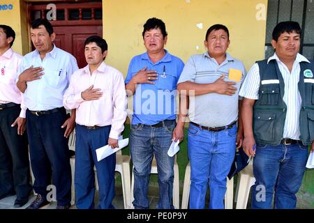 Singing the national anthem - Fiestas Virgen del Carmen in El CARMEN DE LA FRONTERA - Ecuador border -. Department  of Piura .PERU        Stock Photo