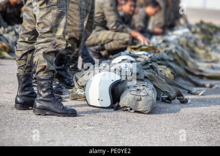 row of police special force paratrooper in camouflage uniform hold T-10 static  line hook and parachute reserve in cinematic tone with copy space Stock  Photo - Alamy