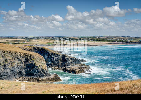 A view from Dinas Head looking back to Booby's Bay and Contantine beach on a beautiful sunny day. Blue Atlantic sea breaking on the rugged coastline. Stock Photo