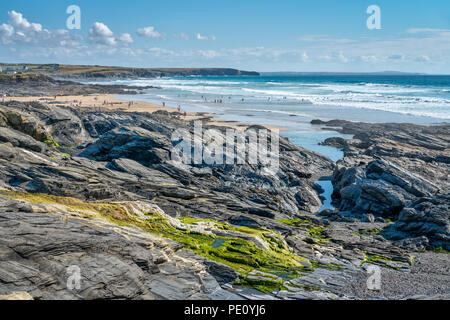 Booby's Bay, Constantine on Cornwalls North Coast showing holiday makers enjoying themselves on the golden sands and in the blue Atlantic Ocean surf. Stock Photo