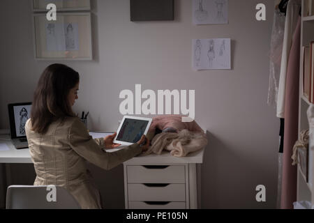Fashion designers using digital tablet Stock Photo