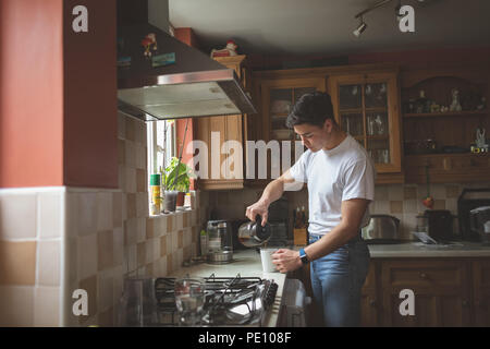 Man preparing coffee in the kitchen Stock Photo