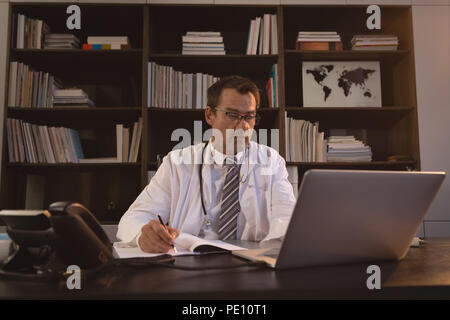 Doctor working in office Stock Photo