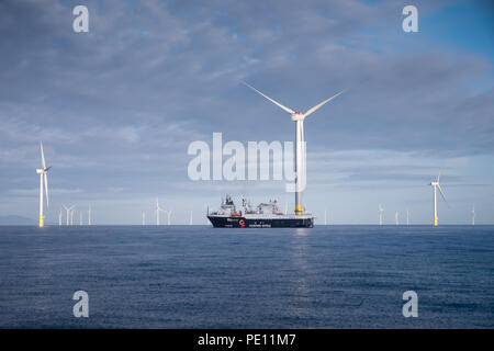 The hotel ship Wind Innovation working on the construction of Walney Extension Offshore Wind Farm in the Irish Sea Stock Photo
