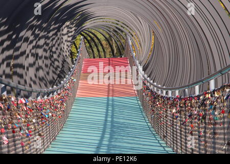 Slinky Springs to Fame with love locks Stock Photo