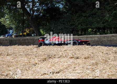 A Formula One car speeds up the Hillclimb at the Goodwood Festival of Speed 2018. Stock Photo