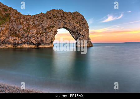 The Durdle Door, part of the Jurassic Coast in southern England, after sunset Stock Photo