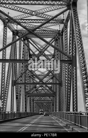 The Clover H Cary bridge aka the Owensboro Blue Bridge on the Ohio river connects Owensboro KY with Indiana  in black and wgit Stock Photo