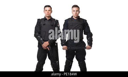 Special force troops with a gun and a baton in black uniform and body armor on white background. Two police officers in special ammunition Stock Photo