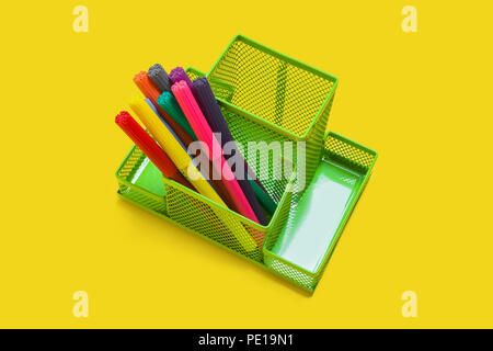 green pencil holder with felt pens Stock Photo