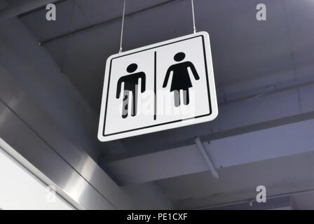 Close up of man and woman washroom logo on roof Stock Photo
