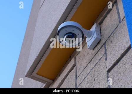 Dome security camera on top of ceiling outside Walmart store Stock Photo