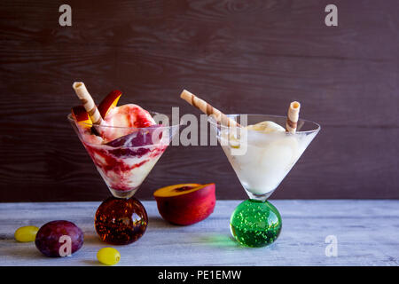 the most beautiful fresh ice-cream of hot summer days and besides the fruits Stock Photo