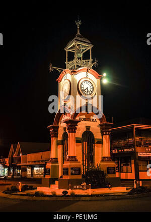 Haast, New Zealand - Apr 30, 2015. Clock tower at night in downtown of Haast, New Zealand. Stock Photo