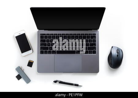 Top view of tabletop with laptop, mobile phone, memory cards, card reader, pen and mouse isolated on white background Stock Photo