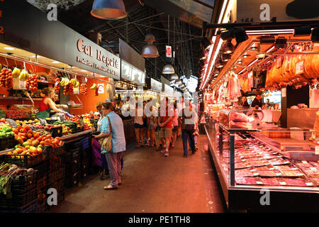 BARCELONA, SPAIN - JULY 13, 2018: people shop in Barcelona Market (Mercat de Sant Josep de la Boqueria), a large public market with entrance Stock Photo