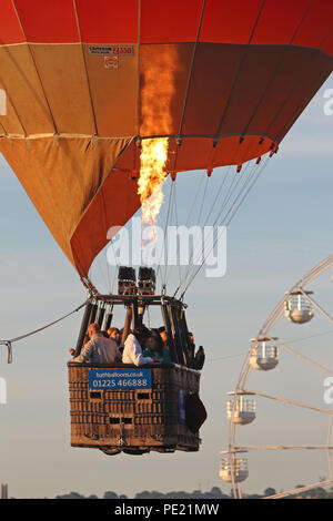 Ashton Court, Bristol, UK. 11th August, 2018. This morning saw 108 balloons take off from Ashton Court in a mass launch as part of the  40th annual Bristol International Balloon Fiesta. Held over four days the fiesta normally see mass launches on the mornings and evenings of the final three days, however due to the weather and strong winds this was the first mass launch of the 2018 Fiesta. With the 2018 event celebrating 40 years of the International Fiesta a larger number of special shaped balloons were in attendance than normal. Credit: Paul Bunch/Alamy Live News Stock Photo