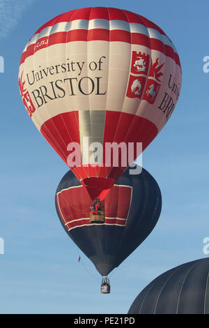 Ashton Court, Bristol, UK. 11th August, 2018. This morning saw 108 balloons take off from Ashton Court in a mass launch as part of the  40th annual Bristol International Balloon Fiesta. Held over four days the fiesta normally see mass launches on the mornings and evenings of the final three days, however due to the weather and strong winds this was the first mass launch of the 2018 Fiesta. With the 2018 event celebrating 40 years of the International Fiesta a larger number of special shaped balloons were in attendance than normal. Credit: Paul Bunch/Alamy Live News Stock Photo