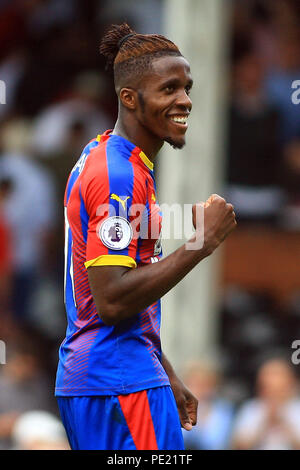 London, UK, 11 Aug 2018. Wilfried Zaha of Crystal Palace celebrates Crystal Palace's victory. Premier League match, Fulham v Crystal Palace at Craven Cottage in London on Saturday 11th August 2018.  this image may only be used for Editorial purposes. Editorial use only, license required for commercial use. No use in betting, games or a single club/league/player publications. pic by Steffan Bowen/Andrew Orchard sports photography/Alamy Live news Stock Photo
