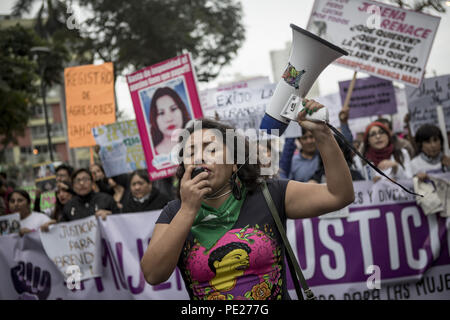 Lima, Peru. 11th Aug, 2018. Demonstrators march during a Ni Una Menos (Not One Less) rally in protest of gender based violence in Lima. Ni Una Menos (Not One Less) demands that women should be protected from violent deaths at the hands of men in Peru. Credit: Guillermo Gutierrez/SOPA Images/ZUMA Wire/Alamy Live News Stock Photo