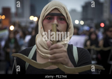 Lima, Peru. 11th Aug, 2018. Demonstrators march during a Ni Una Menos (Not One Less) rally in protest of gender based violence in Lima. Ni Una Menos (Not One Less) demands that women should be protected from violent deaths at the hands of men in Peru. Credit: Guillermo Gutierrez/SOPA Images/ZUMA Wire/Alamy Live News Stock Photo