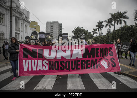 Lima, Peru. 11th Aug, 2018. Demonstrators hold a banner during a Ni una menos rally protest of gender based violence in Lima. Ni Una Menos (Not One Less) demands that women should be protected from violent deaths at the hands of men in Peru. Credit: Guillermo Gutierrez/SOPA Images/ZUMA Wire/Alamy Live News Stock Photo
