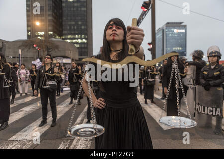 Lima, Peru. 11th Aug, 2018. A demonstrator perform during a Ni Una Menos (Not One Less) rally in protest of gender based violence in Lima. Ni Una Menos (Not One Less) demands that women should be protected from violent deaths at the hands of men in Peru. Credit: Guillermo Gutierrez/SOPA Images/ZUMA Wire/Alamy Live News Stock Photo