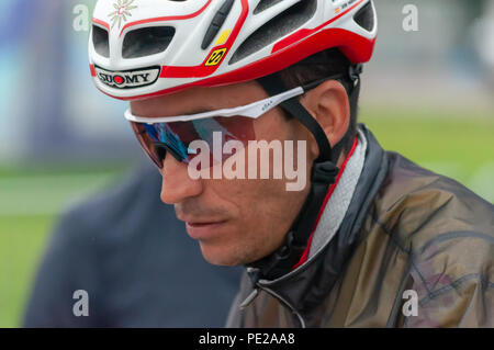 Glasgow, Scotland, UK. 12th August, 2018. A cyclist prepares for the start of the Men's Cycling Road Race covering 16 laps and 230 km through the streets of the city on day eleven of the European Championships Glasgow 2018. Credit: Skully/Alamy Live News Stock Photo