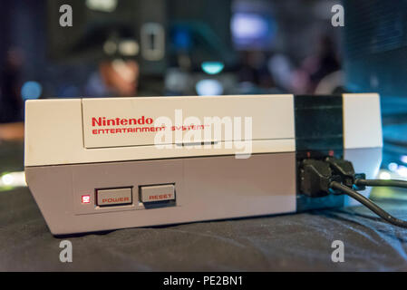 London, UK.  12 August 2018. A Nintendo Entertainment System console at retro games festival PLAY Expo held in London for the first time at Printworks, Canada Water. Game enthusiasts visited to rediscover the classics, from Donkey Kong, Pong, Super Mario Bros. and Space Invaders to vintage pinball machines, VR, indie games and a dedicated Minecraft zone. The show also included a sneak preview of new retro gaming streaming service, Antstream.  Credit: Stephen Chung / Alamy Live News Stock Photo