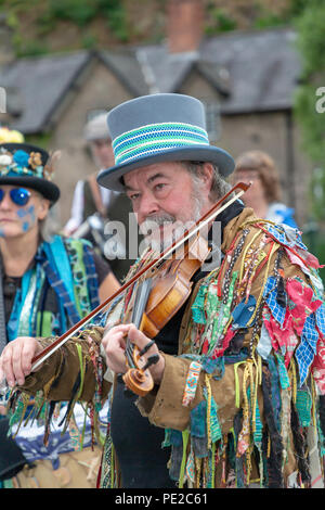 Warrington, UK. 12th August 2018. The ancient tradition of Lymm Rushbearing has been revived after an absence of two years. The event did not involve a procession on local highways as in the past, but after gathering near the Lower Dam about 4 pm and then processing up the Dingle, the festival ended with a service at St Mary’s Church Credit: John Hopkins/Alamy Live News Stock Photo