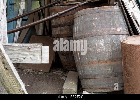 Old wooden barrels for wine in the backyard Stock Photo