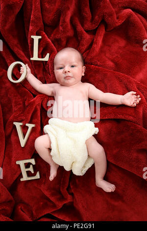 3 week old baby boy - LOVE Stock Photo