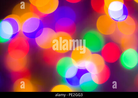 christmas and new year concept - Defocused abstract multicolored bokeh lights background. Blue, purple, green, orange colors. Stock Photo
