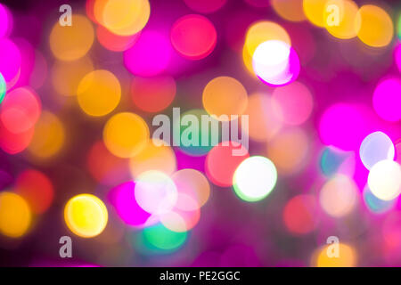christmas and new year concept - Defocused abstract multicolored bokeh lights background. Blue, purple, green, orange colors. Stock Photo