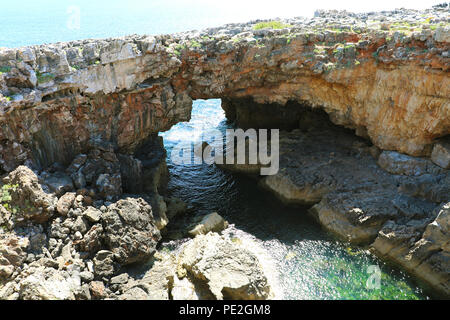 Hell's Mouth (Boca di Inferno) is a chasm located in the seaside cliffs close to the Portuguese city of Cascais, in the District of Lisbon, Portugal Stock Photo