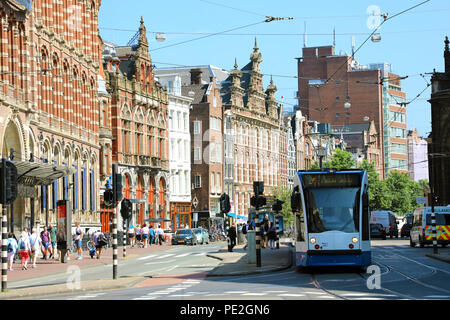 AMSTERDAM, NETHERLANDS - JUNE 6, 2018: Nieuwezijds Voorburgwal street in the centre of Amsterdam contains famous buildings as the Royal Palace, the Ni Stock Photo