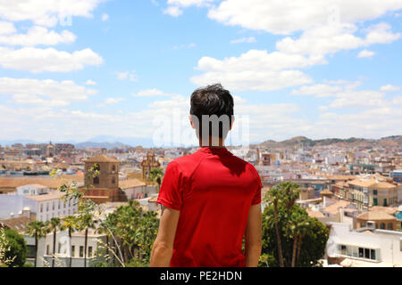 Back view of a man looking at Malaga cityscape, Andalusia, Spain Stock Photo