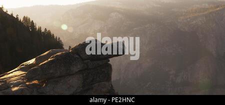 Overhanging rock at sunset at Glacier Point, Yosemite Stock Photo