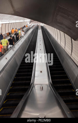 A long escalator from the platform to the mezzanine at the Hudson Yards subway station in Manhattan, NYC. Stock Photo