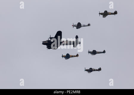 The Avro Lancaster flying in formation with Spitfire and Hurricane aircraft for the RAF100 anniversary flypast over London Stock Photo