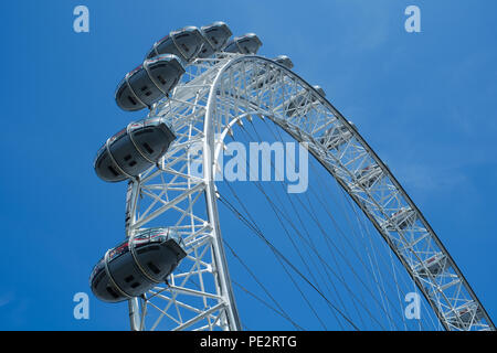Close-up of London Eye against blue sky background Stock Photo