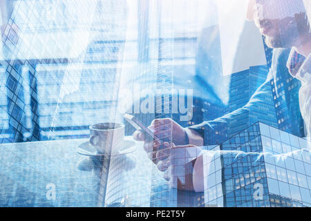 man using smartphone double exposure, mobile app closeup of hands with phone, blue background Stock Photo