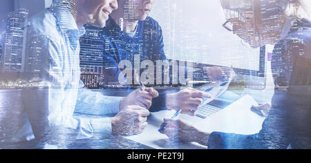 business team of coworkers working on startup in office, banner double exposure background of group of businessman people entrepreneurs Stock Photo