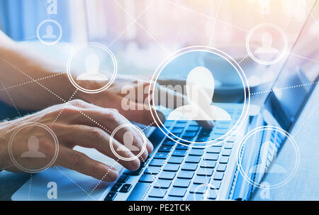 HR, human resources concept, social network with company people icons, online community, hands typing on computer keyboard Stock Photo