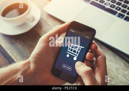shopping online on internet store, order and buy things via mobile smartphone app on the screen, checkout interface in virtual shop Stock Photo