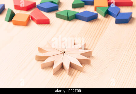Children's game with colored wooden blocks. Draw a Pattern Stock Photo