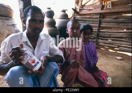 The family of a  suicide in Warangal, India.   Many indian farmers prefer to kill themselves rather than to  face up to the shame of debt - incurred  by  borrowing money to  buy  GM seeds which subsequently  failed to  grow. Stock Photo