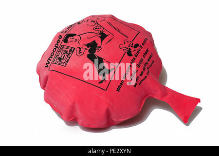 a red novelty Whoopee Cushion made for gags and tricks for fake fart noises Stock Photo