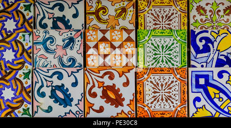 Detail of old traditional ornate portuguese decorative azulejo tiles on display at a souvenir store Stock Photo