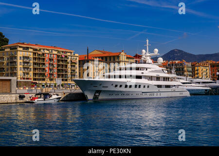 Nice, France - May 24, 2018: View of luxury yachts and traditional Mediterranean buildings in Lympia port of Nice, Côte d'Azur Stock Photo
